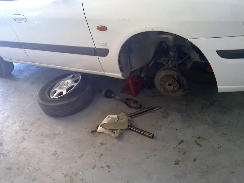 Front wheel removed, exposing the brake rotor and hub